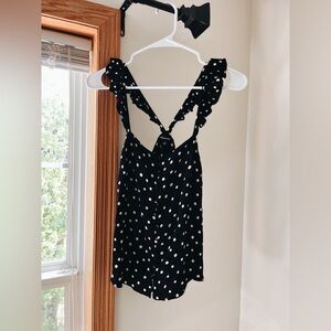 Black and white polka dotted ruffle sleeved tank top